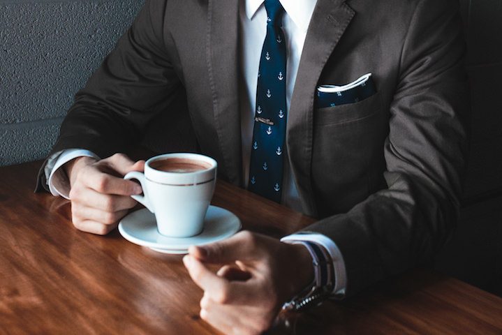 man exec suit coffee